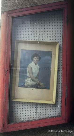 Portrait of woman in Singapore photo studio window